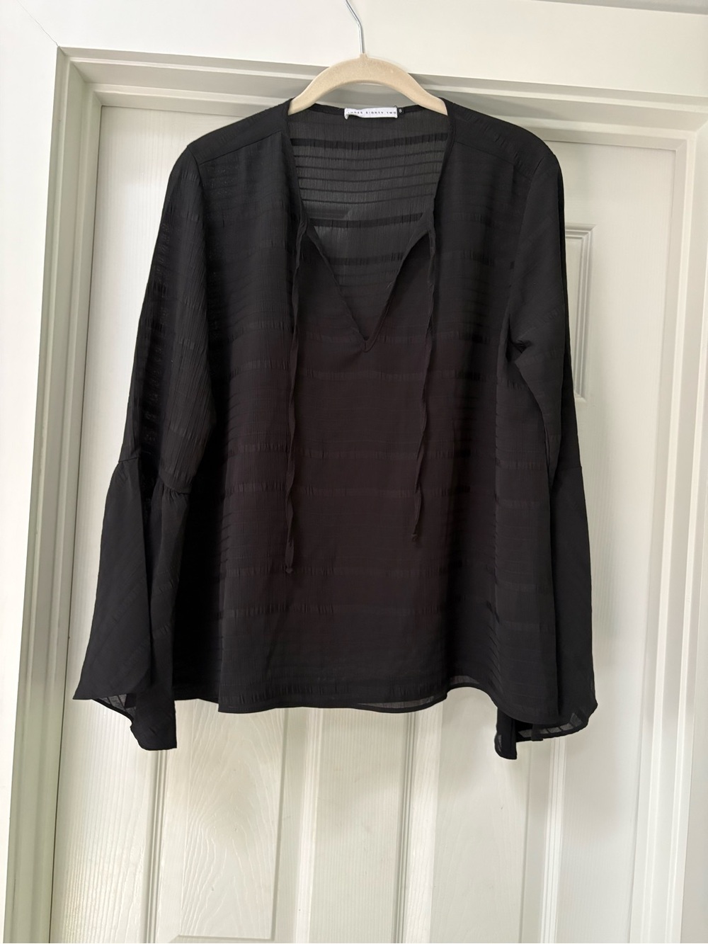 Tie-Neck Black Blouse with Subtle Stripe Texture